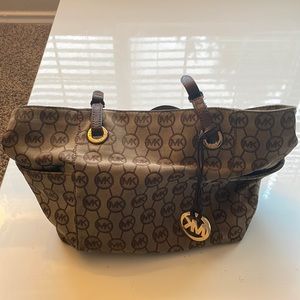 COPY - Tan and brown Michael Kors bag.